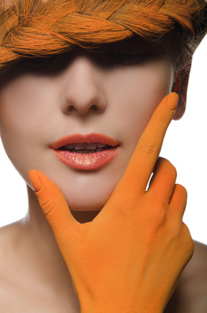 Vertical portrait of woman in orange on white backgroundの写真素材