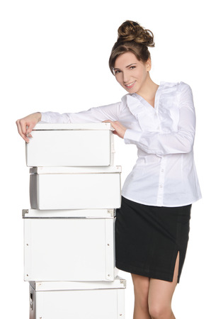 Young girl with white boxes isolated on whiteの写真素材