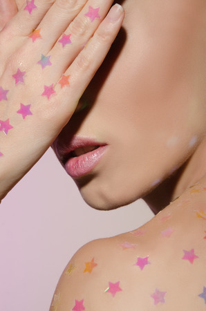 Portrait of young woman in the sprockets with eyes closedの写真素材