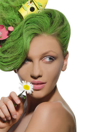 Woman with watering can and starling house in her green hairの写真素材