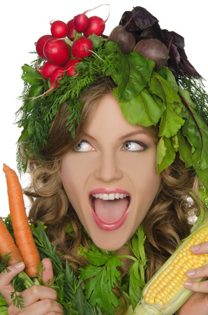 Beautiful young woman with vegetables shoutsの写真素材