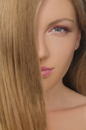 vertical portrait of beautiful woman with straight hairの写真素材
