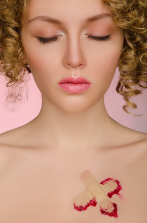 Beautiful woman with a bandage and your eyes closedの写真素材