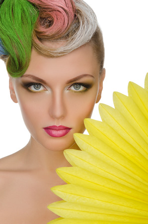 Portrait of youngwoman with bright makeup isolated on whiteの写真素材