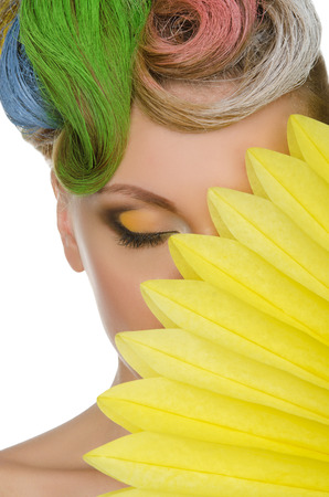 Portrait of beautiful woman with colorful makeup isolated on whiteの写真素材