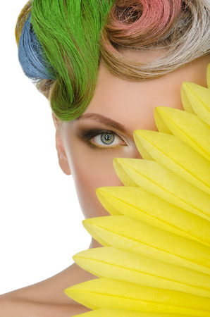 Portrait of young woman with colorful makeup isolated on whiteの写真素材