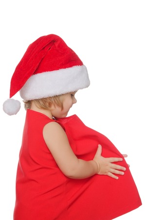 european girl in christmas cap isolated on whiteの写真素材