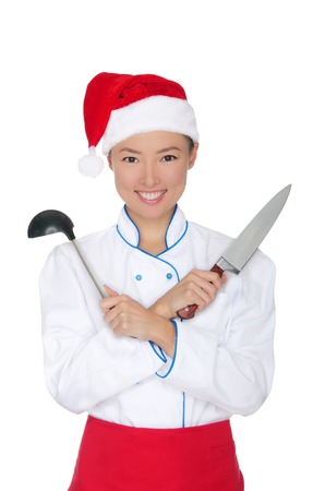smiling asian chef in christmas cap with container isolated on whiteの写真素材