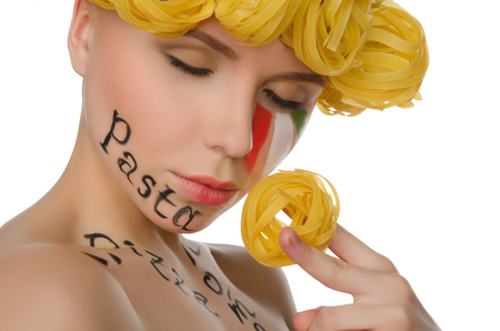 woman with hair pasta and symbols of Italy isolated on whiteの写真素材