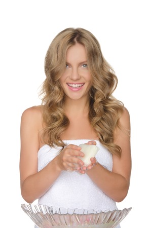 young woman is washing water with flowers, white backgroundの写真素材