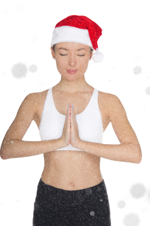 Asian woman in Santa's hat engaged in fitness isolated on whiteの写真素材