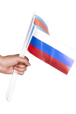 woman s hand holding a paper flags on a white backgroundの写真素材