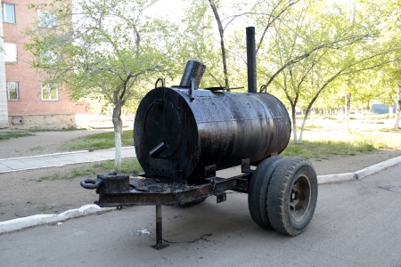 a barrel of tar, which is melted during the repair of roadsの写真素材