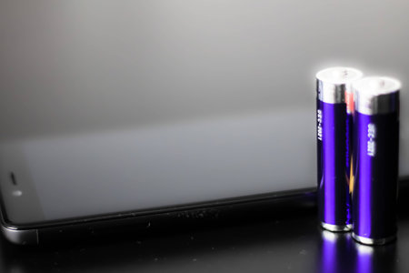 A modern smart phone and batery.の写真素材