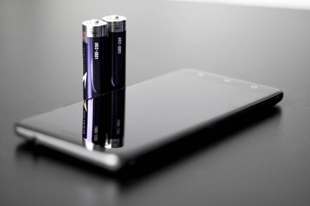 A modern smart phone and batery.の写真素材