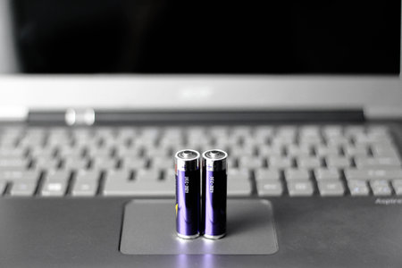 Laptop powered up by batteries with extra energyの写真素材