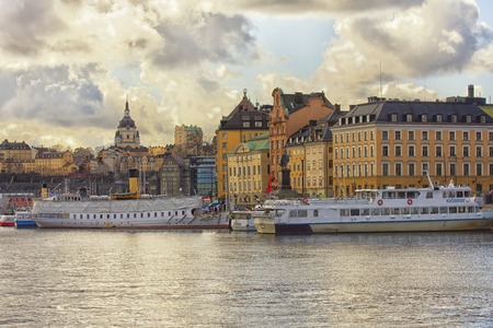 STOCKHOLM, SWEDEN - MARCH 30, 2016: View with the Stockholm harbor, tourist ships and old buildings from the city centerのeditorial素材