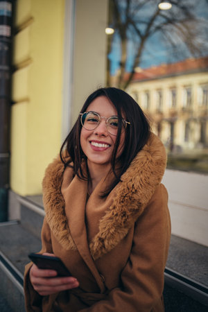 Cropped shot of a beautiful young hispanic woman while out in a cityの写真素材