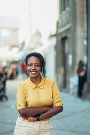 Beautiful young african american woman standing in the city streetの写真素材