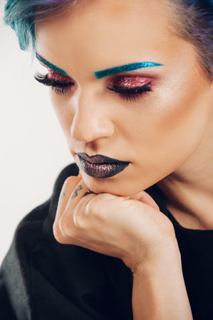 Beautiful glamor caucasian woman model with stylish makeup on the face and a pink lipstick on the...