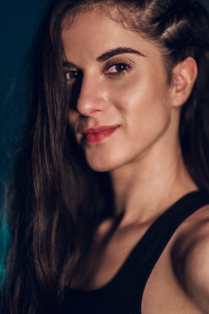 Portrait of an attractive fitness instructor posing and looking happy