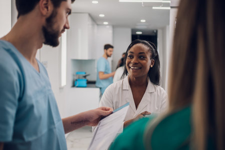 Diverse group of young doctors interns discussing the patient's medical condition while talking in a...