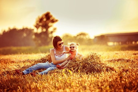 Young happy beautiful mother and her daughterの写真素材