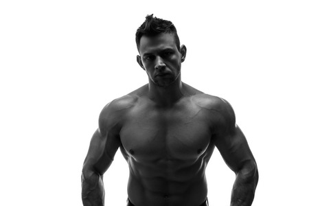 The beautiful and strong young guy. Black and white photo, silhouette.の写真素材