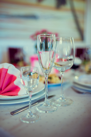 Beautiful wedding day ceremony set up. Indoor. Good served table in a restaurant.の写真素材