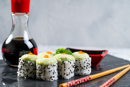 Close up of sushi rools food on black stone tableの写真素材