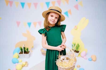 the girl with the rabbit. happy little girl holding cute fluffy Bunny. Friendship with Easter Bunny....