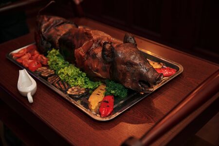 young roasted piggy pig being served at the celebration.の写真素材