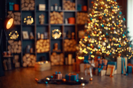 Beautiful holiday decorated room with Christmas tree, out of focus shot for photo background.の写真素材