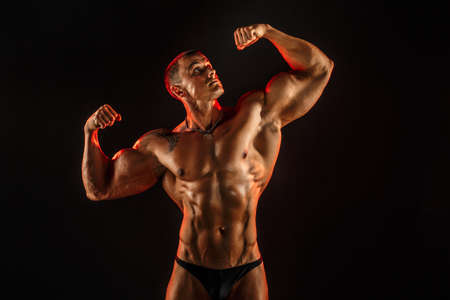 shirtless man with muscular topless body holding arms up. Isolated.の写真素材