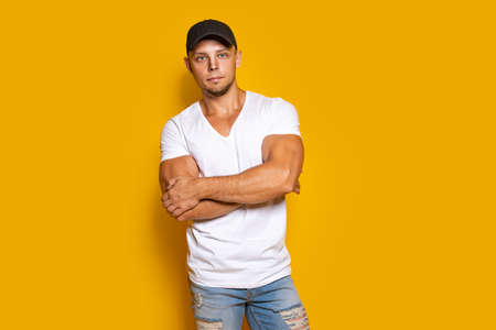 Man in bright clothes on yellowの写真素材