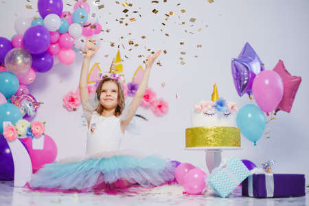 Unicorn Girl throws confetti. Idea for decorating unicorn styleの写真素材