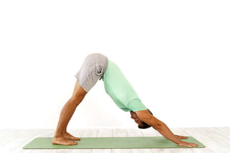 man practicing pilates indoor, return to life sequence, 34 exercise
