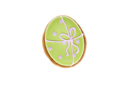 Sweet gingerbread cookies decorated with icing in the form of Easter egg isolated on white...