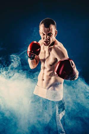 Sportsman boxer fighting on black background. Copy Space. Boxing sport conceptの写真素材