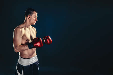 Sportsman boxer fighting on black background. Copy Space. Boxing sport conceptの写真素材