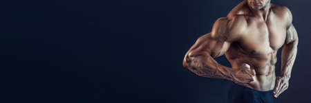 Protein supplements. Muscles for actions. Torso six packs attractive black background. Muscular torso huge muscles result of exhausting trainings and proper nutrition. Muscular torso close upの写真素材