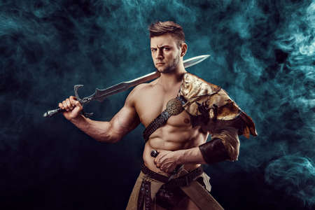 Antique warrior with sword against background with smoke
