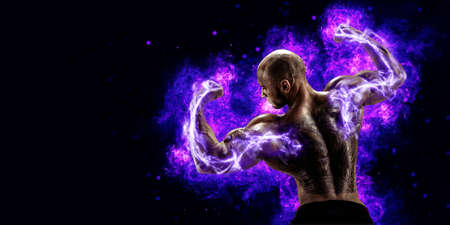 Muscular body builder lifting weight with energy lights on biceps concept