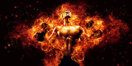 The shirtless abdominal male holds dumbbell. Studio shot in contrasty lightの写真素材