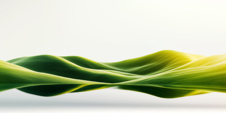 Bright natural light illuminates a clean shoreline silhouette with serene green hills in the background. The calm coastline creates a sense of peaceful harmony at midday.の素材