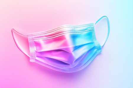 A medical mask floating gently in a pastel colored environment highlights the importance of health and safety measures. The soft hues create a calming effect relevant to the medical field.の素材