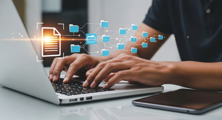 Digital document management laptop hands typing file sharing network data conceptの素材