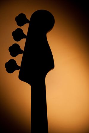 Jazz bass guitar with yellow light