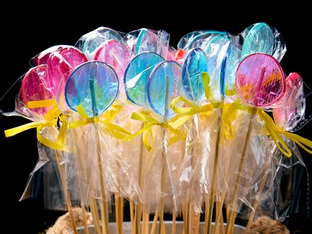 Assorted colors lollipops on black background, close-upの写真素材