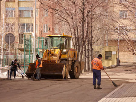 Karaganda, Kazakhstan - 1nd April, 2020 -workers are cleaning the streets